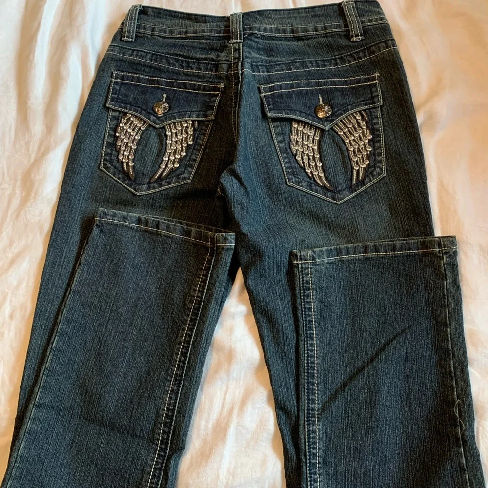 Daniel Jeans Size 3/4 dark denim with back pocket rhinestone embellishments
